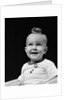 1940s smiling blond boy with big curl on top of head looking up by Anonymous