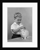 1950slittle boy putting coin into piggy bank by Anonymous