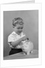 1950slittle boy putting coin into piggy bank by Anonymous