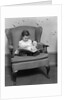 1930s little girl child in large chair with bear reading book by Anonymous