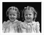 1930s portrait twin girls smiling by Anonymous