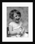 1930s smiling laughing toddler girl holding shoe by Anonymous