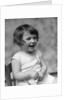 1930s smiling laughing toddler girl holding shoe by Anonymous