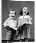 1930s two children standing singing by Anonymous