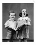 1930s two children standing singing by Anonymous