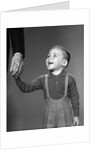 1960s boy holding adult male hand smiling by Anonymous