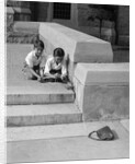 1930s two boys playing trick with string tied to lost purse by Anonymous