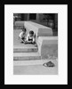 1930s two boys playing trick with string tied to lost purse by Anonymous