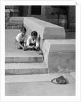 1930s two boys playing trick with string tied to lost purse by Anonymous