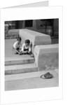 1930s two boys playing trick with string tied to lost purse by Anonymous