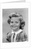 1950s portrait smiling girl with white collar plaid dress looking at camera by Anonymous