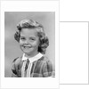 1950s portrait smiling girl with white collar plaid dress looking at camera by Anonymous