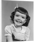 1950s smiling brunette girl with bangs by Anonymous