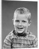 1950s smiling blond boy wearing plaid shirt bow ties looking at camera by Anonymous