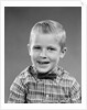 1950s smiling blond boy wearing plaid shirt bow ties looking at camera by Anonymous