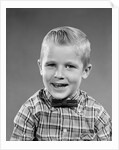 1950s smiling blond boy wearing plaid shirt bow ties looking at camera by Anonymous