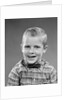 1950s smiling blond boy wearing plaid shirt bow ties looking at camera by Anonymous