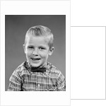 1950s smiling blond boy wearing plaid shirt bow ties looking at camera by Anonymous