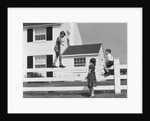 1950s boy walking balancing on fence other children standing sitting next to fence by Anonymous