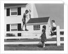 1950s boy walking balancing on fence other children standing sitting next to fence by Anonymous
