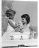 1930s two girls sisters at bathroom sink by Anonymous