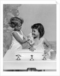 1930s two girls sisters at bathroom sink by Anonymous