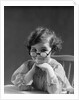 1930s portrait little girl smiling wearing big round eyeglasses looking at camera by Anonymous