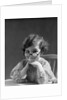 1930s portrait little girl smiling wearing big round eyeglasses looking at camera by Anonymous
