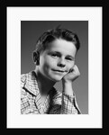 1950s child portrait boy with freckles posed resting head cheek on hand by Anonymous