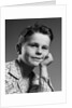 1950s child portrait boy with freckles posed resting head cheek on hand by Anonymous