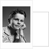 1950s child portrait boy with freckles posed resting head cheek on hand by Anonymous