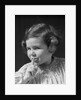 1930s little girl with finger to lips making quiet gesture looking at camera by Anonymous