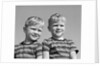 1950s portrait two twin blond boys smiling wearing striped tee shirts brothers by Corbis