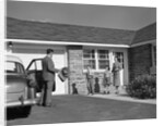 1950s family greeting father in driveway by Anonymous