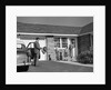 1950s family greeting father in driveway by Anonymous