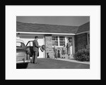 1950s family greeting father in driveway by Anonymous