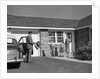 1950s family greeting father in driveway by Anonymous