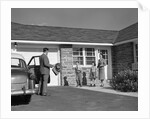 1950s family greeting father in driveway by Anonymous