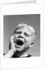 1950s blond boy with eyes closed and hand cupping a wide open mouth shouting by Anonymous