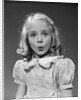 1940s 1950s blond girl whistling lips puckered eyes wide open looking at camera by Anonymous