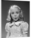 1940s 1950s blond girl whistling lips puckered eyes wide open looking at camera by Anonymous