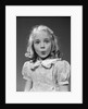 1940s 1950s blond girl whistling lips puckered eyes wide open looking at camera by Anonymous
