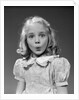 1940s 1950s blond girl whistling lips puckered eyes wide open looking at camera by Anonymous