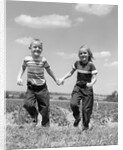 1950s boy girl running grassy farm field holding hands by Anonymous