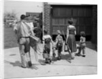 1950s family mother father 3 children from behind carrying gardening home improvement tools equipment by Anonymous