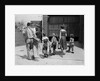 1950s family mother father 3 children from behind carrying gardening home improvement tools equipment by Anonymous