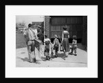 1950s family mother father 3 children from behind carrying gardening home improvement tools equipment by Anonymous