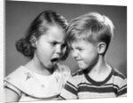 1950s boy and girl arguing head to head by Anonymous