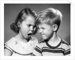 1950s boy and girl arguing head to head by Anonymous