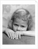 1930s portrait sad little blond girl peeking over her hands looking at camera by Anonymous